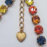 Nell Bijoux Luna Matte Gold L003 - La Vie en Rose Damesmode (6) Details Luna Matte Gold L103 Orange and Gold: Lengte: ca. 49 cm, inclusief sluiting en het verlengstukje Sluiting: Lobster sluiting Kristallen: Swarovski Metaalkleur: Matte Gold Nikkelvrij: Ja SKU/ProductID: L103 Maat model: Eén maat, ca. 49 cm